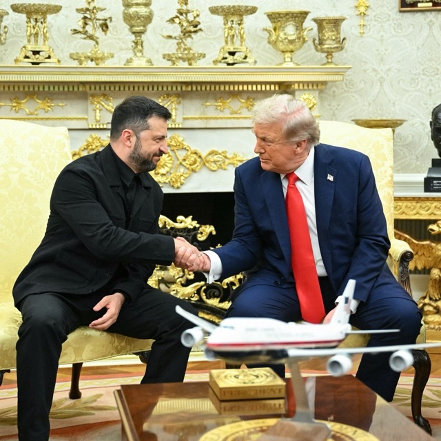 Donald Trump and Volodymyr Zelensky shake hands in the Oval Office