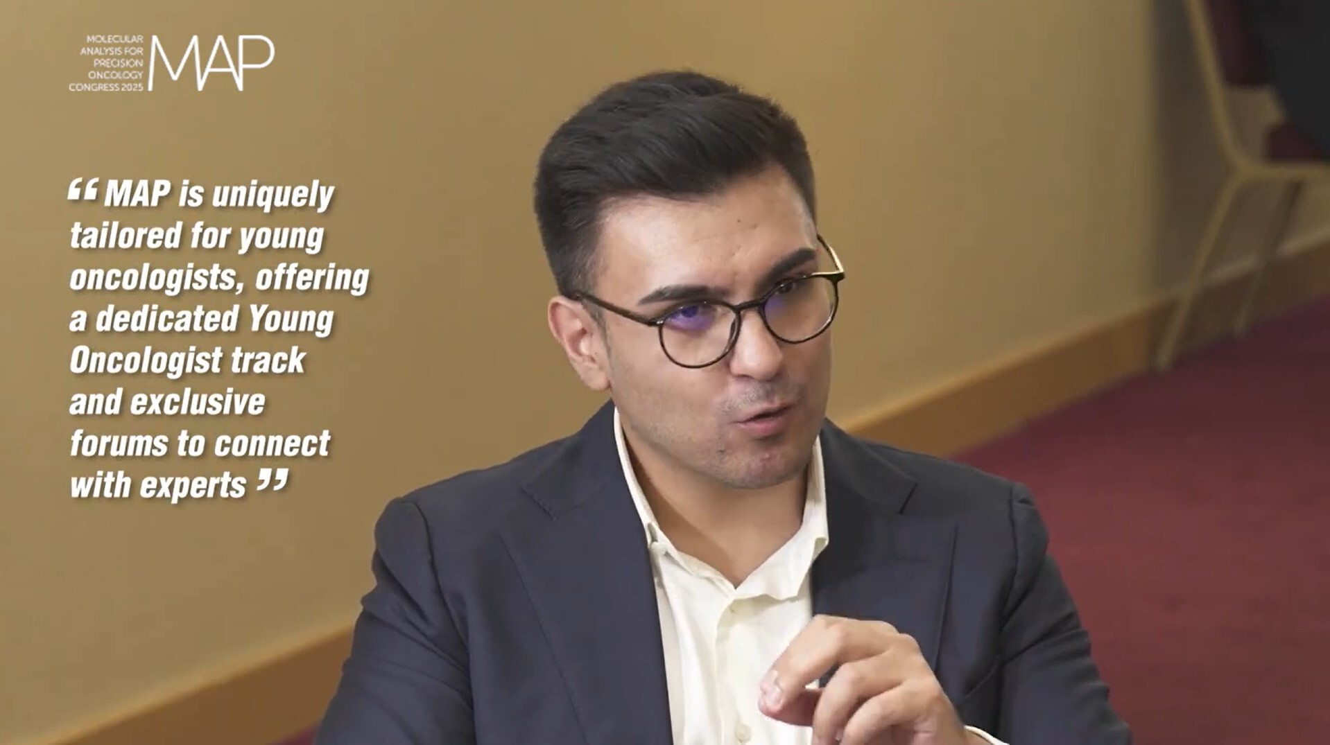 Man talking, whilst making a hand gesture, he is wearing glasses. Quote next to him reads "MAP is uniquely tailored for young oncologists, offering a dedicated Young Oncologist track and exclusive forums to connect with experts"
