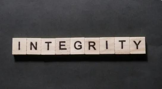 Image of integrity spelled out with scrabble-like pieces